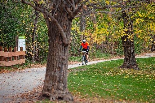 Daniel Crump / Winnipeg Free Press. A person rides their bike through Assiniboine Park Saturday afternoon. October 9, 2021.