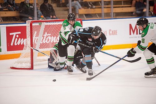 MIKE SUDOMA / Winnipeg Free Press
Winnipeg Ice forward, Jackson Leppard, fight Prince Albert Raiders Tayem Gisalason (left) and Zachary Wilson (right) for the puck Saturday night at Wayne Fleming Arena
October 8, 2021