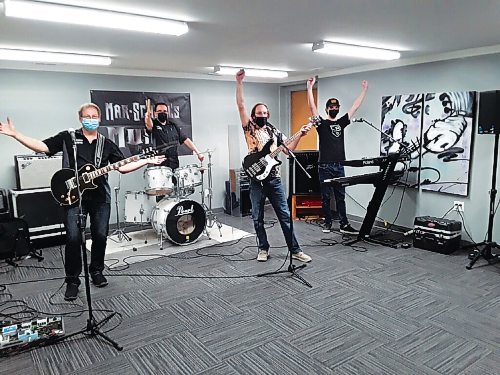 Canstar Community News 
Clients and staff members of Mar-Schells Music enjoy a band rehearsal in the stores new performance space.