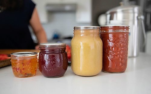 JESSICA LEE / WINNIPEG FREE PRESS

From left to right: canned chili peppers, raspberry jam, apple sauce and tomato sauce.



