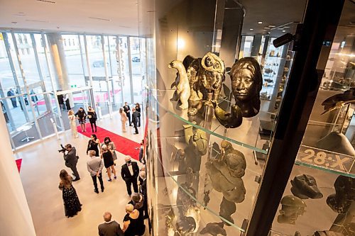 MIKE SUDOMA / Winnipeg Free Press
Inuit art sits on a shelf as guests come in along the red carpet during the Quamajaq Ball at the Winnipeg Art Gallery Saturday night
October 14, 2021