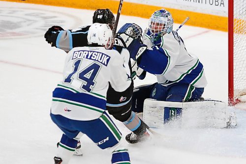 JOHN WOODS / WINNIPEG FREE PRESS
Swift Current Broncos goaltender Isaac Poulter (1) smiles at Winnipeg Ice Connor McClennon (94) as he saves the shot during second period WHL action in Winnipeg on Sunday, October 17, 2021.