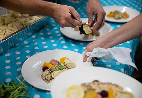 JESSICA LEE / WINNIPEG FREE PRESS

Chefs plate sunflower-oil-poached chicken breasts for the Free Press Fall Supper at Whitetail Meadow on October 17, 2021.






