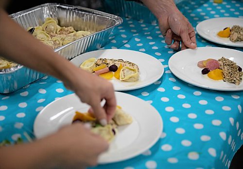 JESSICA LEE / WINNIPEG FREE PRESS

Chefs plate sunflower-oil-poached chicken breasts for the Free Press Fall Supper at Whitetail Meadow on October 17, 2021.


