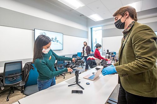 MIKAELA MACKENZIE / WINNIPEG FREE PRESS

Student Fawnda Neckoway (left) and instructor Rylaan Gimby set up a gimbal in the Digital Film and Media Production program freelance video class at RRC Polytechs new Innovation Centre in Winnipeg on Monday, Oct. 18, 2021. This program is the first to be learning in the new space. For Josh Frey-Sam story.
Winnipeg Free Press 2021.