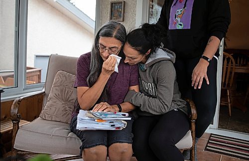 JESSICA LEE / WINNIPEG FREE PRESS

Theresa Jobse (left) lost her husband Alfred on September 3, 2021. Alfred spent his last 18 hours alone on his hospital bed and the family is traumatized from the experience. Cindy McKague, the youngest daughter, (right) comforts her mother in their home on October 19, 2021, along with the eldest daughter Alicia Thwaites (background).

Reporter: Danielle







