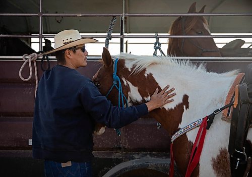 JESSICA LEE / WINNIPEG FREE PRESS

Chris Tacan of the Sioux Valley Dakota Nation Unity Riders ties a horse during the end of the annual Kidney Walk and Ride on October 10, 2021. 

Reporter: Melissa
