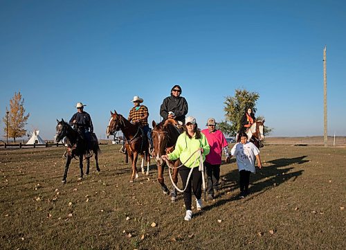 JESSICA LEE / WINNIPEG FREE PRESS

Helena Mazawasicuna of the Sioux Valley Dakota Nation Unity Riders leads a horse carrying Karen Benn, an amputee, during the annual Kidney Walk and Ride on October 10, 2021. 

Reporter: Melissa
