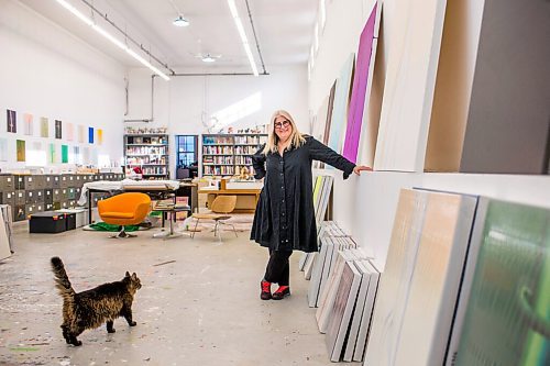 MIKAELA MACKENZIE / WINNIPEG FREE PRESS

Wanda Koop poses for a portrait with her cat, Henry, among new works (inspired by the dead poplars around her cabin, where she created the paintings) in her studio in Winnipeg on Thursday, Oct. 21, 2021. For Al Small story.
Winnipeg Free Press 2021.