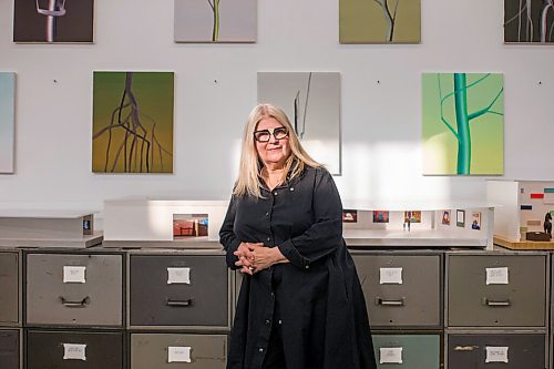 MIKAELA MACKENZIE / WINNIPEG FREE PRESS

Wanda Koop poses for a portrait among new works (inspired by the dead poplars around her cabin, where she created the paintings) in her studio in Winnipeg on Thursday, Oct. 21, 2021. For Al Small story.
Winnipeg Free Press 2021.