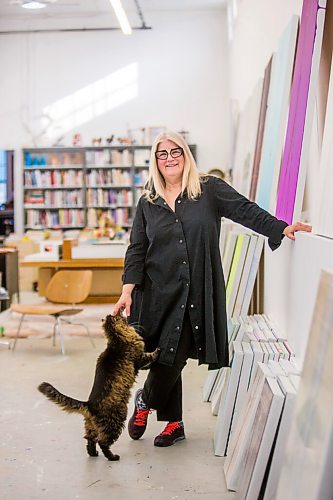 MIKAELA MACKENZIE / WINNIPEG FREE PRESS

Wanda Koop poses for a portrait with her cat, Henry, among new works (inspired by the dead poplars around her cabin, where she created the paintings) in her studio in Winnipeg on Thursday, Oct. 21, 2021. For Al Small story.
Winnipeg Free Press 2021.