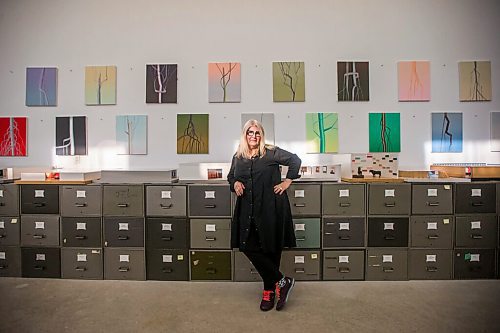 MIKAELA MACKENZIE / WINNIPEG FREE PRESS

Wanda Koop poses for a portrait among new works (inspired by the dead poplars around her cabin, where she created the paintings) in her studio in Winnipeg on Thursday, Oct. 21, 2021. For Al Small story.
Winnipeg Free Press 2021.