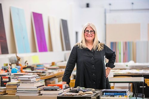 MIKAELA MACKENZIE / WINNIPEG FREE PRESS

Wanda Koop poses for a portrait among new works (inspired by the dead poplars around her cabin, where she created the paintings) in her studio in Winnipeg on Thursday, Oct. 21, 2021. For Al Small story.
Winnipeg Free Press 2021.