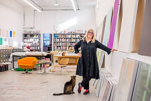 MIKAELA MACKENZIE / WINNIPEG FREE PRESS

Wanda Koop poses for a portrait with her cat, Henry, among new works (inspired by the dead poplars around her cabin, where she created the paintings) in her studio in Winnipeg on Thursday, Oct. 21, 2021. For Al Small story.
Winnipeg Free Press 2021.