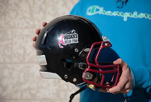 JESSICA LEE / WINNIPEG FREE PRESS

A Sturgeon Heights student holds his football helmet with a fresh Huskies cancer sticker on October 21, 2021. Many at the community of Sturgeon Heights have been affected by cancer.

Reporter: Mike






