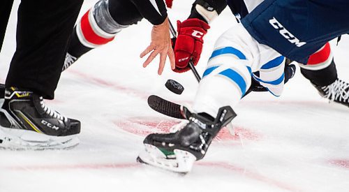 MIKE SUDOMA / Winnipeg Free Press
The Manitoba Moose and Grand Rapids Griffins face off in the first period of their game at Canada Life Place Friday
October 22, 2021