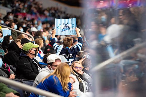 MIKE SUDOMA / Winnipeg Free Press
A young Moose fan holds up a sign in between place as the Manitoba Moose take on the Grand Rapids Griffins Friday night at Canada Life Place
October 22, 2021