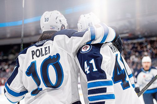 MIKE SUDOMA / Winnipeg Free Press
Manitoba Moose leftside, Evan Polei shares a moment with centre, Cole Maier after Maier scored a second period goal as they take on the Grand Rapids Griffins Friday night at Canada Life Place
October 22, 2021