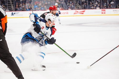 MIKE SUDOMA / Winnipeg Free Press
As the Manitoba Moose left side, Mikey Eyssimont sprays up slush as he makes his way past Griffins defence Friday night at Canada Life Place
October 22, 2021