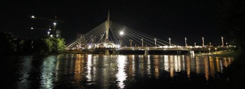 PHIL.HOSSACK@FREEPRESS.MB.CA 100527-Winnipeg Free Press THe Provencher Foot Bridge is lit up "Hollywood Style" Wednesday evening as a scene from a movie starring Milla Jovovich uses the structure for a scene.........See Wayne Boyce's fantasy......