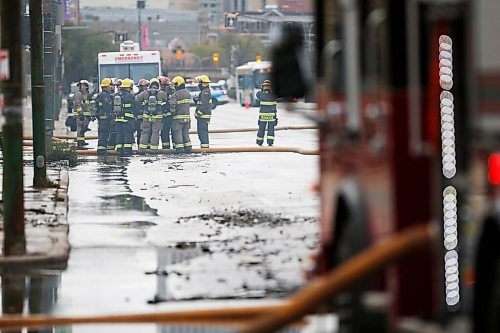 JOHN WOODS / WINNIPEG FREE PRESS
Firefighters work a fire scene at a building in the 800 block of Main Street Sunday, October 24, 2021

Reporter: Standup