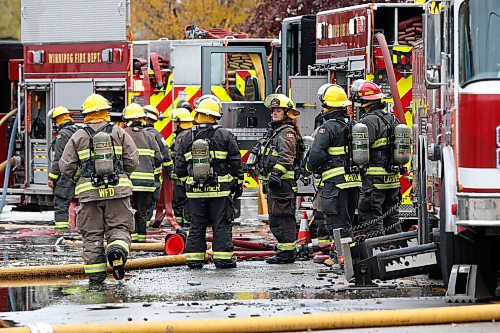 JOHN WOODS / WINNIPEG FREE PRESS
Firefighters work a fire scene at a building in the 800 block of Main Street Sunday, October 24, 2021

Reporter: Standup