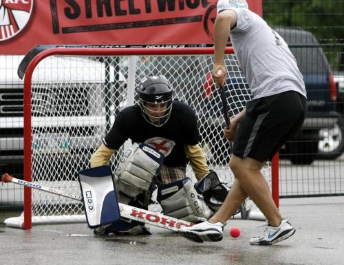 MIKE.DEAL@FREEPRESS.MB.CA 100529 - Saturday, May 29th, 2010 Keenan Mcgouran goalie for team "4 Shots My X" warms up during a rain delay for the Play On street hockey tournament that was supposed to start at 8am but was pushed back to 12:40pm because of thunder storms. The tournament is taking place on Memorial Blvd and Broadway in front of the Manitoba Legislature. MIKE DEAL / WINNIPEG FREE PRESS