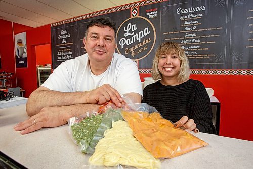 MIKE DEAL / WINNIPEG FREE PRESS
Holding bags of pre-made pasta dinners, Alfonso Maury, owner of La Pampa and Corrientes Argentine Pizzeria with his daughter, Brand Supervisor at La Pampa, Nadia Maury. Alfonso has started a new fresh pasta venture called Tuco. He's making fresh, handmade Argentinian pastas and pre-made pasta dishes for sale to the public through La Pampa (his grocery market) at 1604 St. Mary's Road.
See Eva Wasney story
211028 - Thursday, October 28, 2021.