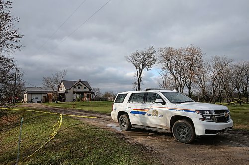 SHANNON VANRAES/WINNIPEG FREE PRESS
RCMP vehicles park in front of a home near the community of New Bothwell, where a 73-year-old woman was found deceased, on October 28, 2021.