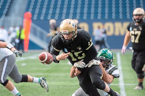 Mike Sudoma / Winnipeg Free Press
Bisons Quarterback, Sawyer Thiessen, fumbles the ball in the first half of their game against the University of Saskatchewan Huskies Saturday
October 30, 2021
