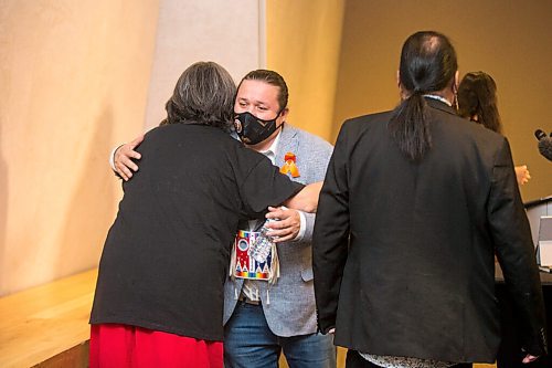 MIKAELA MACKENZIE / WINNIPEG FREE PRESS

Southern Chiefs Organization Grand Chief Jerry Daniels hugs sixties scoop survivor Teri Starr after an announcement calling on the federal government to commission a national inquiry into the sixties scoop in Winnipeg on Monday, Nov. 1, 2021. For JS story.
Winnipeg Free Press 2021.