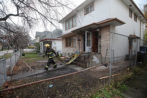 JOHN WOODS / WINNIPEG FREE PRESS
Firefighters clean up at a fire scene at 702 Maryland in Winnipeg Monday, November 1, 2021. 

Reporter: ?