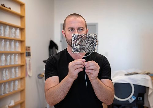 JESSICA LEE / WINNIPEG FREE PRESS

Chris Dorosz shows an example of a newspaper clipping which he has poked holes into on November 1, 2021 in his studio in downtown Winnipeg. The viewer is meant to manipulate the piece using a flashlight and make shadows on a wall.

Reporter: Alan







