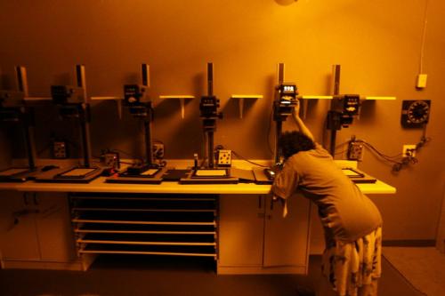 MIKE.DEAL@FREEPRESS.MB.CA 100529 - Saturday, May 29th, 2010 One of the Eritrean women makes traditional print in the darkroom at Prairieview. See Carol Sanders story. MIKE DEAL / WINNIPEG FREE PRESS