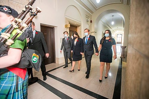 MIKAELA MACKENZIE / WINNIPEG FREE PRESS

Heathe Stefanson walks in to her swearing-in ceremony hand-in-hand with her family at the Manitoba Legislative Building in Winnipeg on Tuesday, Nov. 2, 2021. For --- story.
Winnipeg Free Press 2021.