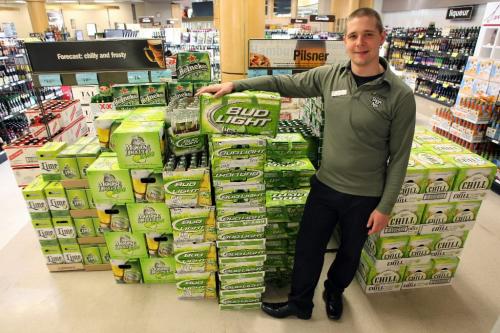 BORIS.MINKEVICH@FREEPRESS.MB.CA  100601 BORIS MINKEVICH / WINNIPEG FREE PRESS Jason Lavack poses with some lime flavoured beers they sell at the MLCC at Grant Park Mall.