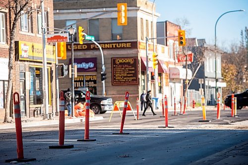 Mike Sudoma / Winnipeg Free Press
A a pedestrian walks by a construction site at Selkirk Ave and Salter St Wednesday afternoon
November 2, 2021