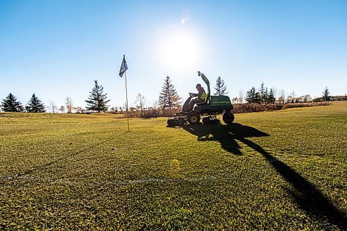 Mike Sudoma / Winnipeg Free Press
Southside Golf Course Superintendant, Craig Campbell, cuts a temporary golf green Wednesday afternoon to get ready for a weekend full of golfers who will be taking advantage of the warmer temperatures this upcoming weekend 
November 3, 2021