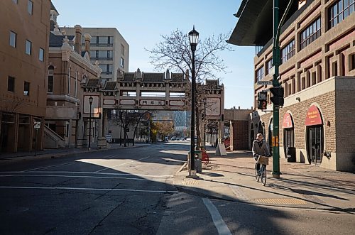 JESSICA LEE / WINNIPEG FREE PRESS

A woman bikes through Chinatown in Winnipeg on November 3, 2021.








