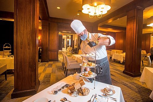 MIKAELA MACKENZIE / WINNIPEG FREE PRESS

Richard Duncan, executive sous chef at the Fairmont, brings out the Winnie-the-Pooh themed high tea, which is part of the hotel's 50-year anniversary celebrations, in Winnipeg on Thursday, Nov. 4, 2021. For Eva Wasney story.
Winnipeg Free Press 2021.