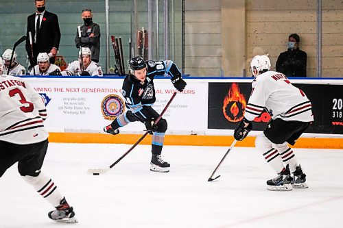 Daniel Crump / Winnipeg Free Press. Winnipeg forward Connor McClennon (94) shoots the puck towards the Red Deer goal during the first period of the Thursday evening matchup. The Winnipeg Ice take on the Red Deer Rebels at the Wayne Fleming Arena in Winnipeg. November 4, 2021.