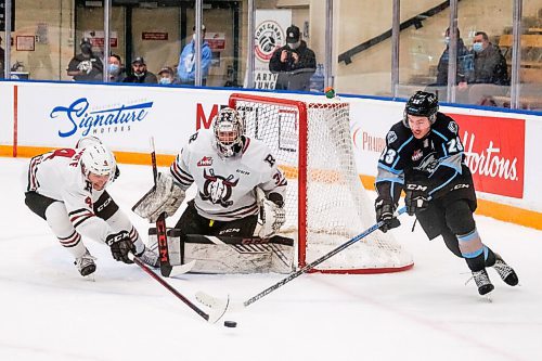 Daniel Crump / Winnipeg Free Press. Winnipeg forward Jakin Smallwood (23) looses the puck as he carries it around the Red Deer net. The Winnipeg Ice take on the Red Deer Rebels at the Wayne Fleming Arena in Winnipeg. November 4, 2021.