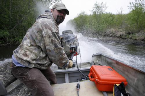 MIKE.DEAL@FREEPRESS.MB.CA 100519 - Wednesday, May 19th, 2010 OPASKWAYAK CREE NATION Students from the land-based education course at Joe E. Ross School. Teacher Randy Koshel maneuvers the boat over the beaver dam while out searching for Mud Hen eggs for the community feast. See Nick Martin story. MIKE DEAL / WINNIPEG FREE PRESS