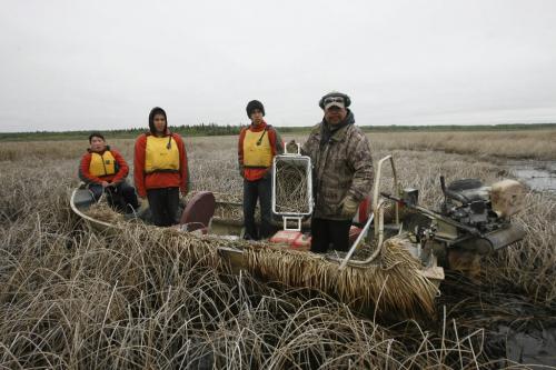 MIKE.DEAL@FREEPRESS.MB.CA 100519 - Wednesday, May 19th, 2010 OPASKWAYAK CREE NATION Students from the land-based education course at Joe E. Ross School. Omar Constant holds up the cooler that he filled with reeds to hold the eggs after the first nest was found. (l-r) Students Norman Ballantyne, Brennan Constant and Andrew Bignell. A nest of Mud Hen eggs sits among the reeds on Pike Lake. Nests can have up to ten eggs, but the students are taught to always leave a few behind so that the population of birds can be maintained. See Nick Martin story. MIKE DEAL / WINNIPEG FREE PRESS