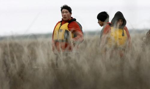 MIKE.DEAL@FREEPRESS.MB.CA 100519 - Wednesday, May 19th, 2010 OPASKWAYAK CREE NATION Students from the land-based education course at Joe E. Ross School. Norman Ballantyne (left) helps guide the boat through the reeds while Andrew Bignell (centre) and Brennan Constant (right) keep watch for Mud Hen eggs on Pike Lake. See Nick Martin story. MIKE DEAL / WINNIPEG FREE PRESS