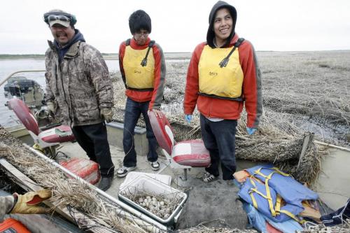 MIKE.DEAL@FREEPRESS.MB.CA 100519 - Wednesday, May 19th, 2010 OPASKWAYAK CREE NATION Students from the land-based education course at Joe E. Ross School. Stopping for a break the students are all smiles after finding about 30 eggs in only a couple of hours. (l-r) Omar Constant (left), Andrew Bignell (centre) and Brennan Constant (right).  See Nick Martin story. MIKE DEAL / WINNIPEG FREE PRESS