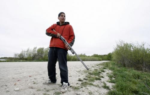 MIKE.DEAL@FREEPRESS.MB.CA 100519 - Wednesday, May 19th, 2010 OPASKWAYAK CREE NATION Students from the land-based education course at Joe E. Ross School. Brennan Constant demonstrates proper gun handling which is taught in the course at Joe E. Ross School. See Nick Martin story. MIKE DEAL / WINNIPEG FREE PRESS