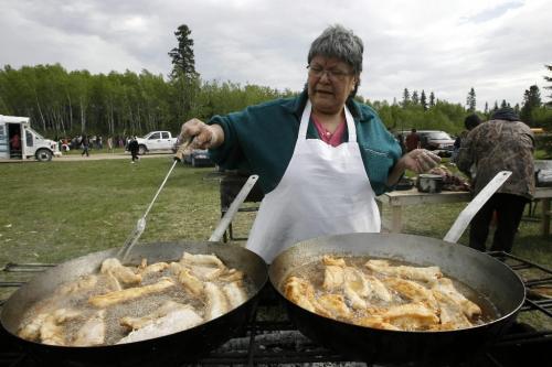 MIKE.DEAL@FREEPRESS.MB.CA 100520 - Thursday, May 20th, 2010 OPASKWAYAK CREE NATION Matilda has been up for hours frying up the fresh hand breaded pickerel for the traditional camp and community feast which will be hosted by students from Joe E. Ross School. See Nick Martin story. MIKE DEAL / WINNIPEG FREE PRESS