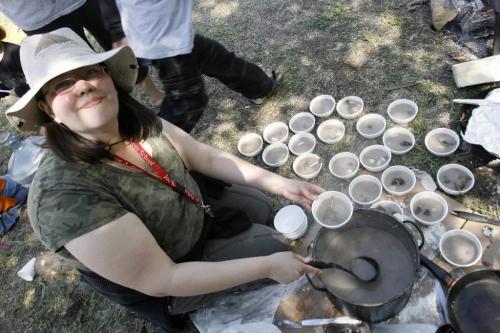 MIKE.DEAL@FREEPRESS.MB.CA 100520 - Thursday, May 20th, 2010 OPASKWAYAK CREE NATION Francine Young doles out some duck soup for her grade one students at the Joe E. Ross School traditional camp and community feast. See Nick Martin story. MIKE DEAL / WINNIPEG FREE PRESS