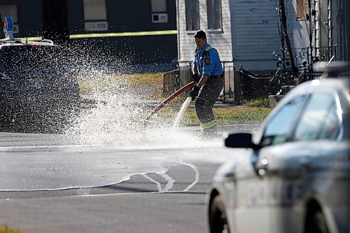 JOHN WOODS / WINNIPEG FREE PRESS
A firefighter washes blood from the road after police investigated at the scene of a homicide at Burrows and Aikens in Winnipeg on Sunday, November 7, 2021. 

Re: Thorpe